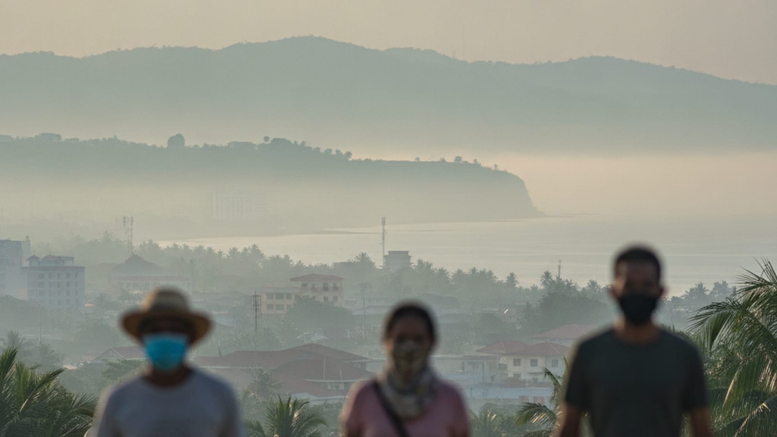 A hazy view over Dili, Timor-Leste, with indistinct features, suggesting reduced visibility due to smoke.
