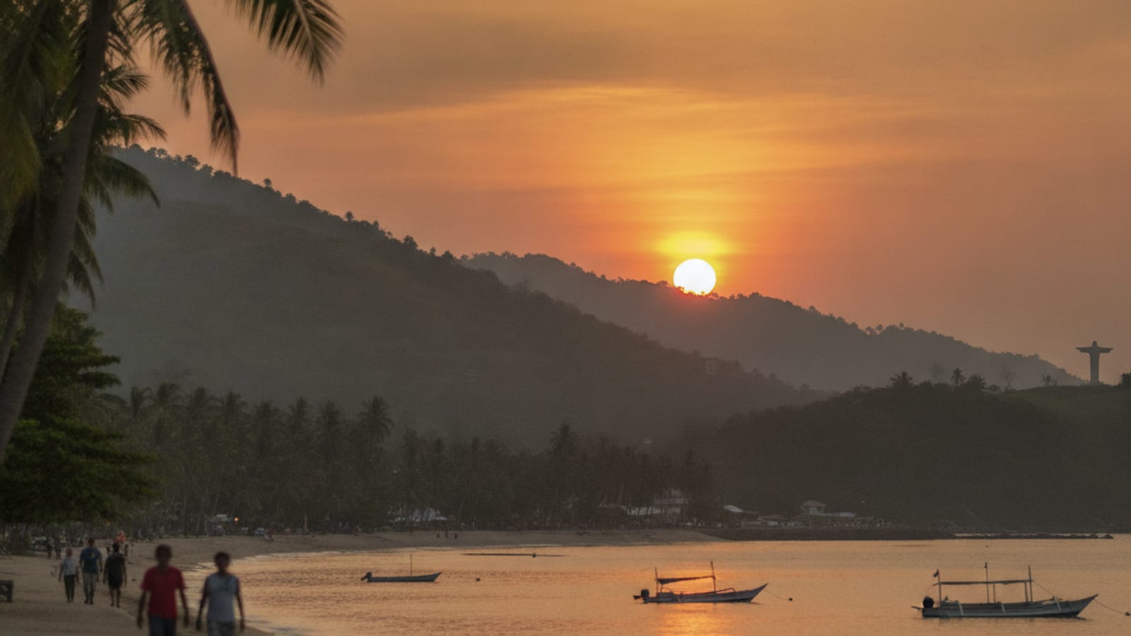 A warm sunrise over the Dili waterfront and hills