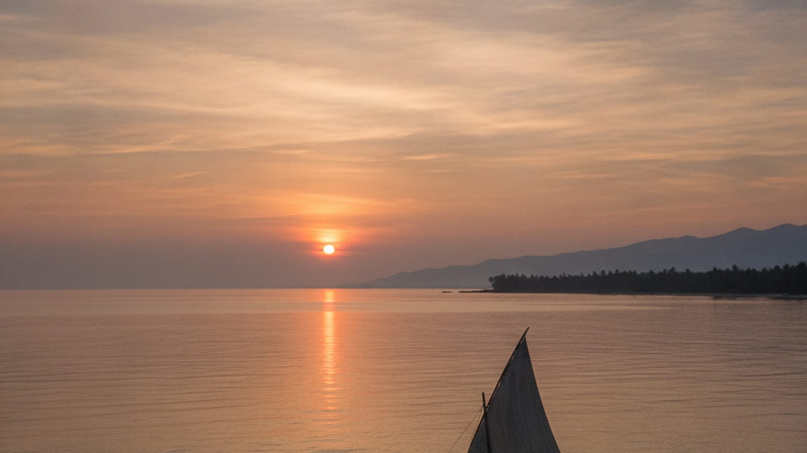 Sunrise over the ocean near Dili, with a traditional fishing boat, representing Timor-Leste's maritime interests.