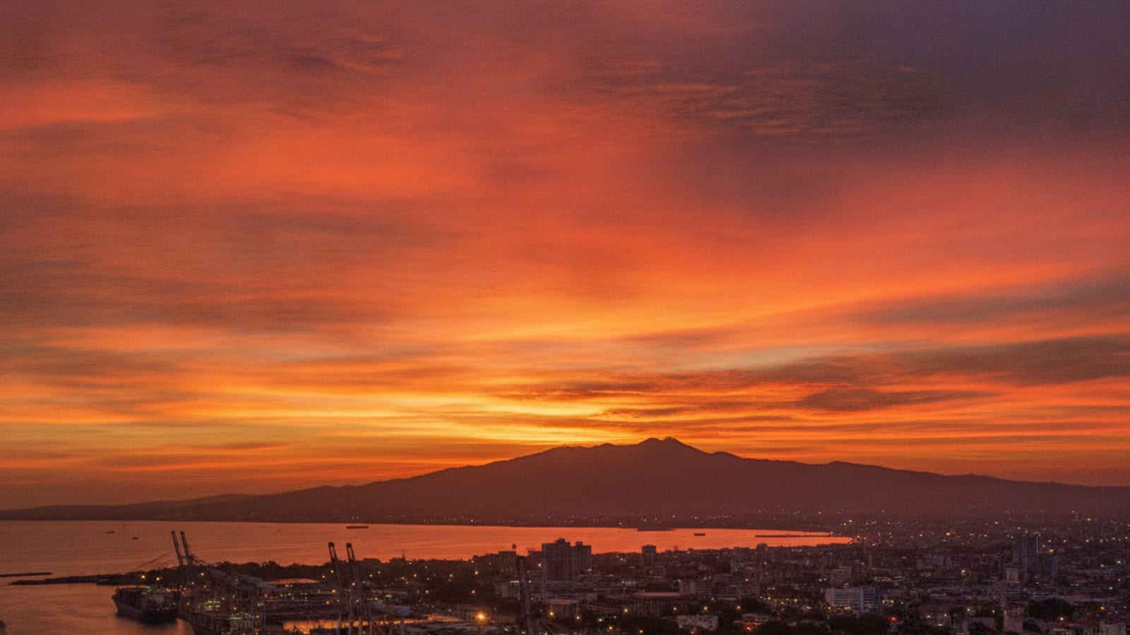 Dili cityscape and port at sunset, symbolizing Timor-Leste's economic integration into ASEAN.
