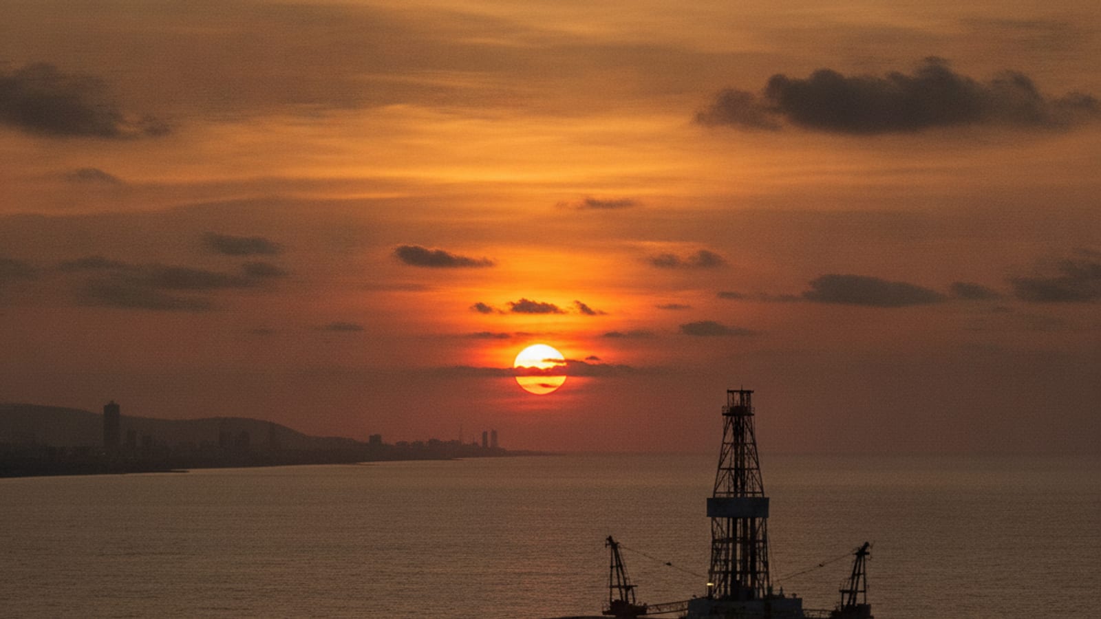 An oil rig operating offshore, symbolising global energy investment and resource development.